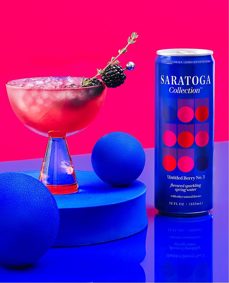 The Saratoga Collection Untitled Berry No. 3 Gin Spritz cocktail with a can of Saratoga Collection Untitled Berry No. 3